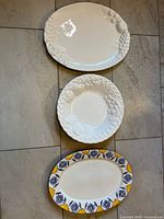 All three platters laid out for size and design comparison