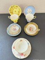Group shot of all five teacup and saucer sets