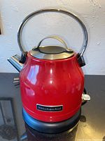 Front view of KitchenAid electric kettle on base
