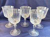 Group of five St. Germain crystal wine glasses