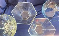 Group shot of all four bowls including hexagonal pair, Marinex scalloped bowl, and Princess House etched crystal bowl