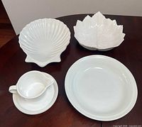 All five white ceramic serving pieces displayed
