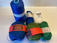 Overview of all six yarn items including cone and balls