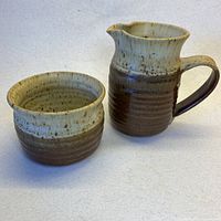creamer pitcher and sugar bowl side by side