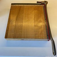 Top view of Ingento wooden paper cutter showing full board and cast iron arm
