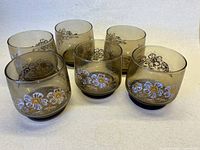 Front view of all six Libbey smoky brown floral glasses