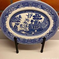 Full view of oval Blue Willow platter on stand