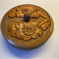 Top view of closed bowl showing carved lid design