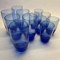 All 12 cobalt blue glasses, two heights visible