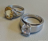Both sterling silver rings side by side showing stones and settings