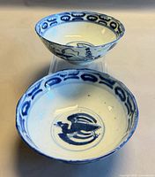 Both blue & white crane bowls, interior designs visible