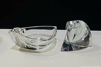 Two heavy clear crystal candle holders side view
