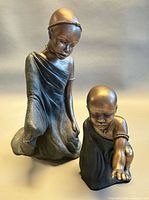 Front view of both Soul Journeys figurines