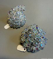 Both brooches angled for size and style reference