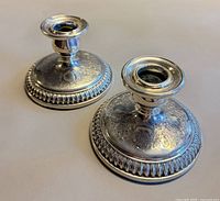 Pair of Birks sterling weighted candle holders front view showing design and height
