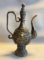 Full view of ewer showing lid, spout, handle and base