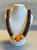 Necklace on bust showing front arrangement of beads