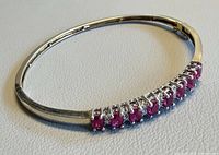 Full view of bracelet laid flat showing stone arrangement