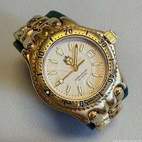 Front angled view of the watch showing case, bezel and bracelet