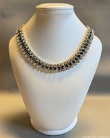 Full view of choker on display bust showing overall design