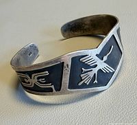 Front view showing V-shape and bird motif