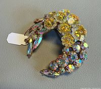 Front view of crescent brooch showing rhinestone arrangement