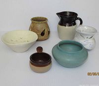 All six pottery pieces grouped together