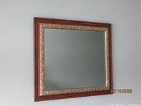 Full view of rectangular mirror showing oak frame and gilded inner edge