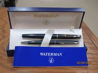 Open Waterman box showing pen, pencil, ribbon, and booklet