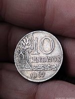 Reverse of 1967 10 Centavos coin showing denomination, industrial scene, coffee branch and date