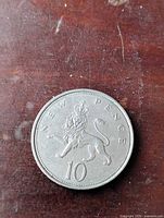 Reverse side displaying crowned lion and denomination 10 NEW PENCE