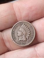 Obverse of 1906 Indian Head Cent showing date and UNITED STATES OF AMERICA legend