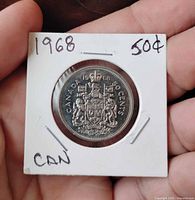 Front of 1968 Canadian 50-cent coin inside cardboard flip