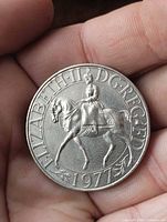 Obverse showing Queen Elizabeth II on horseback with legend ELIZABETH II D G REG FD 1977