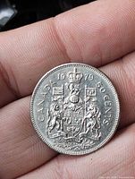Reverse side of 1979 Canadian 50-cent coin showing Coat of Arms and denomination