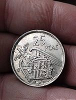 Reverse showing value 25 PTAS and Spanish coat of arms with eagle, yoke and arrows