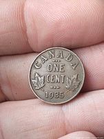 Reverse side showing CANADA FIVE CENTS 1935 with maple leaves