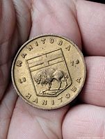 Obverse showing Manitoba shield, bison and dates