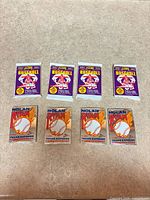 Eight sealed trading card packs: four Score Series 2, four Classic Nolan Ryan