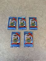 Front view of five sealed 1991 Ultimate hockey card packs