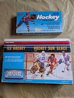 Both boxed games: Radio Shack Ice Hockey and NHL card game