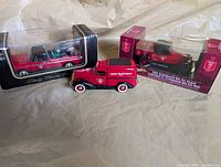 Group shot of the three Canadian Tire die-cast vehicles showing two boxed and one loose