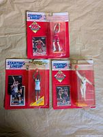 All three sealed Starting Lineup NBA figures on display