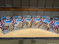 Front view of all six sealed Captain America action figures lined up