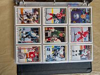 Binder page showing nine 1991-92 O-Pee-Chee Premier hockey cards in sleeves