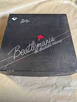 Closed black box showing Beatlemania title