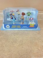 Front view of sealed Toy Story figurine playset showing six characters