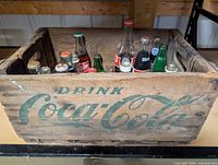 Side view showing ‘Drink Coca-Cola’ graphic and bottle tops