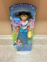 Front view of boxed Mirabel Madrigal singing doll