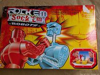 Front of 2001 Rock ‘Em Sock ‘Em Robots box showing graphics and branding